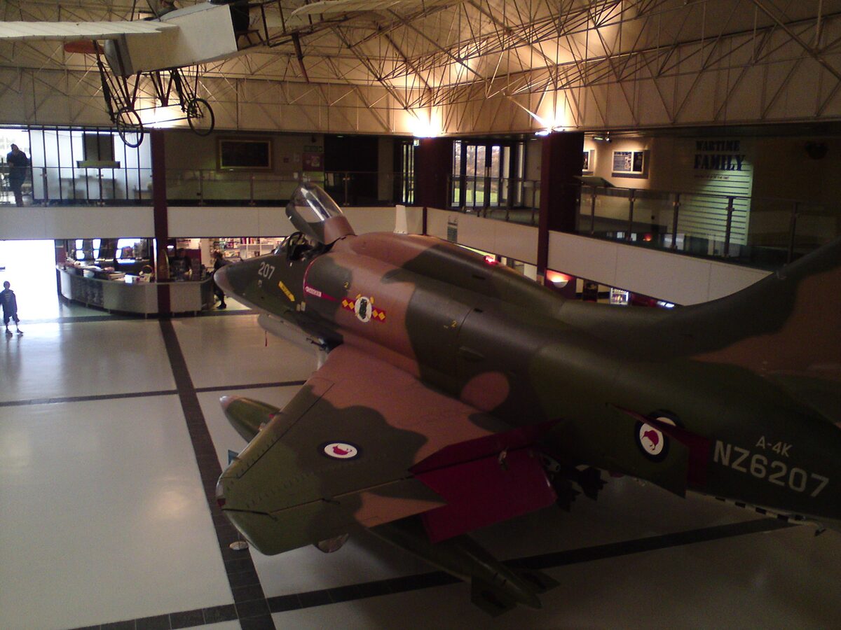 A-4K Skyhawk jet at the main entrance of the Air Force Museum Christchurch with biplane above